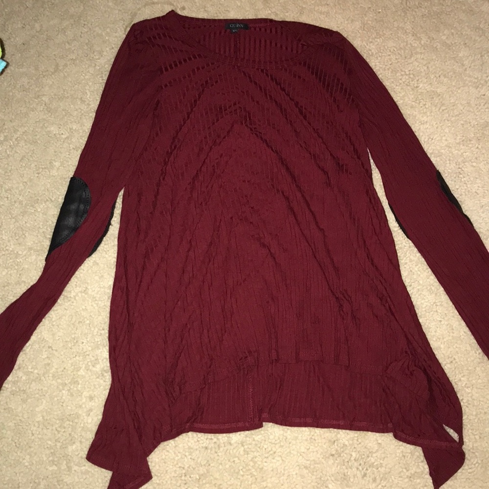 maroon sweater with heart detailing on the elbows